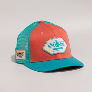 Orange and teal cap with a patch 