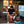 Man wearing Men's Lost Boy Definition Tee performing on stage with guitar | Lost Boy Creations Key West