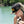 A Pirate's Life for Me Hat in Black — lifestyle shot on model on the water, yellow pirate skull emblem front, Conch Republic patch on side | Lost Boy Creations Key West