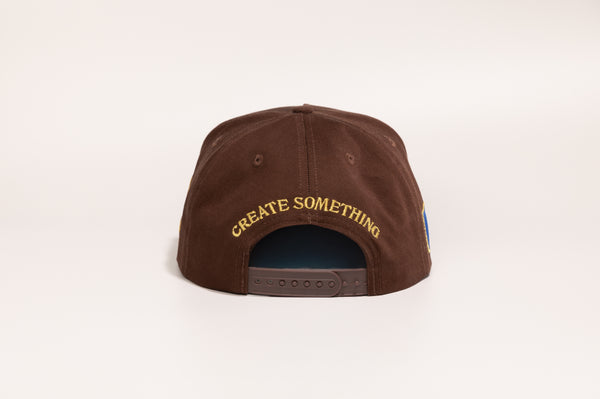Joe Samba Collaboration hat back view with "Create Something" gold keyhole embroidery and plastic adjustable clasp | Lost Boy Creations Key West