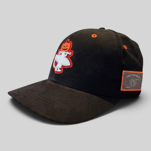 Lost Boy Creations Halloween Hat 2026 in Black — angled front view, jack-o'-lantern Lost Boy logo and orange-bordered Conch Republic flag patch | Lost Boy Creations Key West