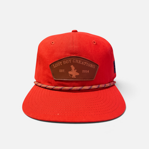 Tomato Soup Hat in Rustic Red — front product photo, red snapback hat with brown leather patch and rope trim | Lost Boy Creations Key West