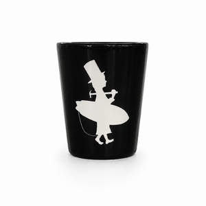 Black shot glass with white silhouette design 