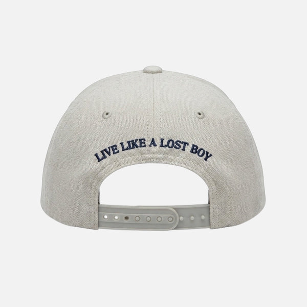 The Vanilla Ice Hat ivory structured trucker hat back view with navy "Live Like a Lost Boy" embroidery and adjustable snapback closure | Lost Boy Creations Key West
