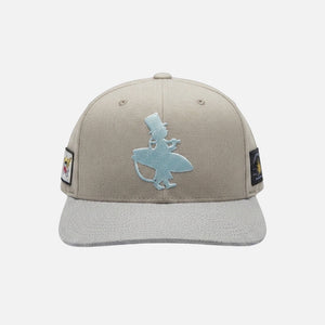 The Vanilla Ice Hat ivory structured trucker hat front view with icy blue raised Lost Boy Creations logo embroidery and flag patches on each side | Lost Boy Creations Key West