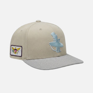 The Vanilla Ice Hat ivory structured trucker hat three-quarter view with icy blue Lost Boy logo embroidery and U.S. Virgin Islands flag patch on left side | Lost Boy Creations Key West
