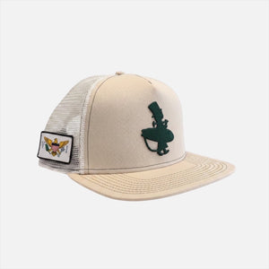 Forest Sand Dunes tan structured trucker hat side view with forest green LBC surfer embroidery and U.S. Virgin Islands flag patch white mesh back | Lost Boy Creations Key West