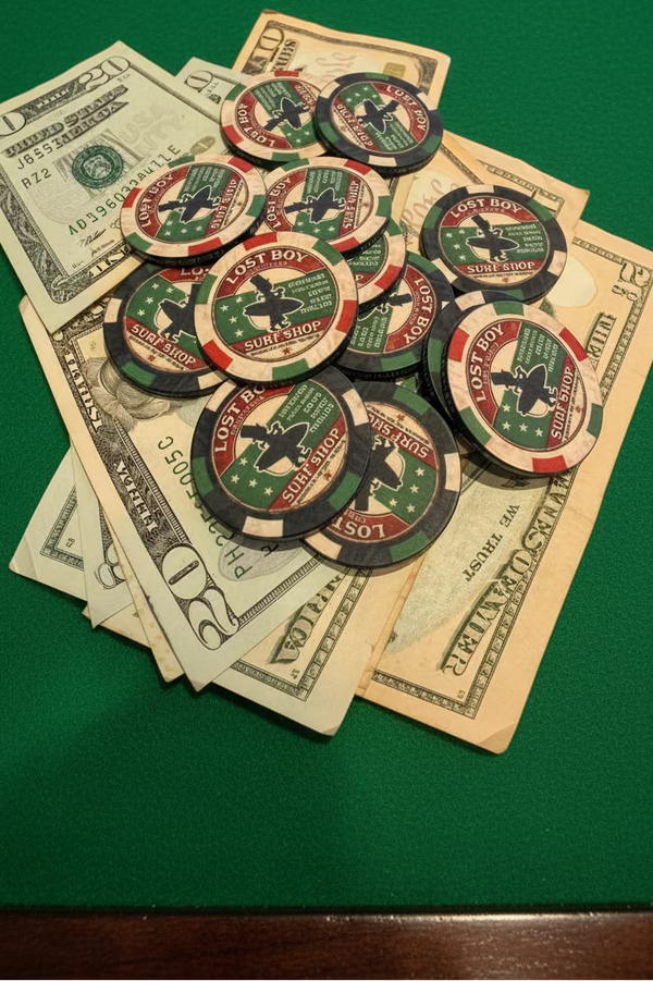 Lost Boy Creations Poker Chip in Red & Green — lifestyle shot, mixed colorway chips stacked on cash on green felt poker table | Lost Boy Creations Key West