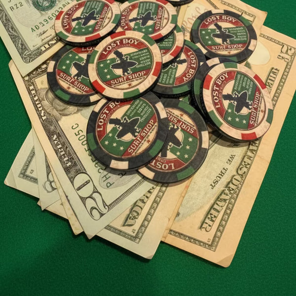 Lost Boy Creations Poker Chip in Red & Green — lifestyle shot, mixed colorway chips stacked on cash on green felt poker table | Lost Boy Creations Key West