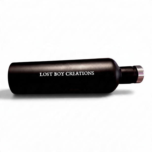 LBC Captain's Bottle in Black/White — horizontal side view, white Lost Boy Creations lettering and silver cap | Lost Boy Creations Key West