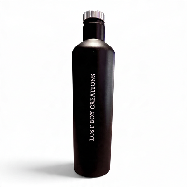 LBC Captain's Bottle in Black/White — back upright view, vertical white Lost Boy Creations lettering and silver cap | Lost Boy Creations Key West