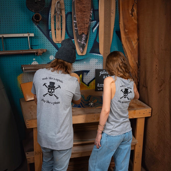 Women's Pirate Tank in Gray — lifestyle shot, back view on model alongside Men's Pirate Tee | Lost Boy Creations Key West