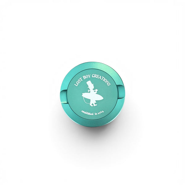 Utility Pocket Tin in Dark Green — front view, LBC surfer silhouette logo on lid | Lost Boy Creations Key West