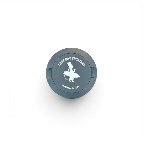 Utility Pocket Tin in Black — front view, LBC surfer silhouette logo on lid | Lost Boy Creations Key West