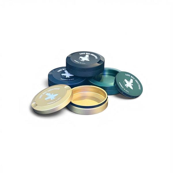Utility Pocket Tin — all colorways Black, Dark Green, Dark Blue, and Gold shown open and closed | Lost Boy Creations Key West