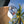 Lei'd Back navy floral low crown trucker hat displayed on a surfboard with palm trees in the background | Lost Boy Creations Key West
