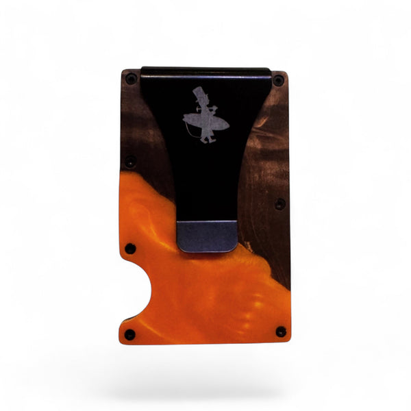 Lost Boy Creations wood and epoxy cash clip card holder Orange colorway front view showing engraved Lost Boy silhouette logo | Lost Boy Creations Key West