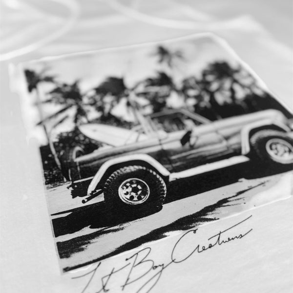 Women's Bronco Racerback Tank in White — angled closeup of black and white Bronco graphic | Lost Boy Creations Key West