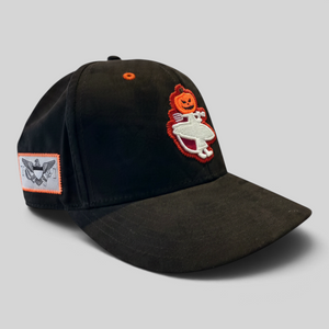  Lost Boy Creations Halloween Hat 2026 in Black — angled front view, jack-o'-lantern Lost Boy logo and orange-bordered USVI flag patch | Lost Boy Creations Key West