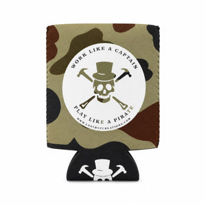 Lost Boy Koozie - Pirate 2.0 in Camo — graphic front flat lay, olive skull & crosstools Work Like a Captain Play Like a Pirate badge | Lost Boy Creations Key West