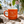Lost Boy Creations Campfire Mug in Orange — hero shot lifestyle, cream 'Might be coffee… Probably Rum' text graphic | Lost Boy Creations Key West
