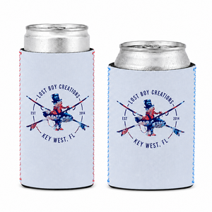 Lost Boy Koozie - Floral in Dusty Blue — hero shot, slim can and standard can with cans inserted, navy coral and pink floral surfer logo | Lost Boy Creations Key West