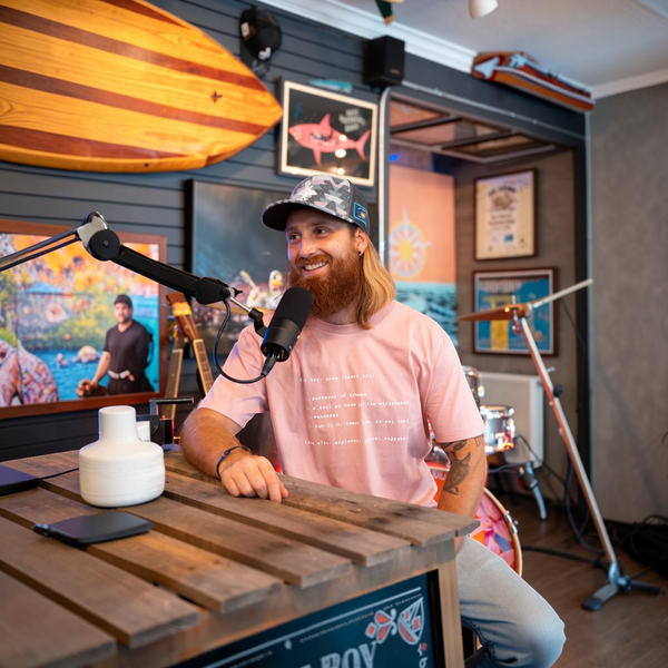 Man wearing Men's Lost Boy Definition Tee and fuzzy hat during interview | Lost Boy Creations Key West