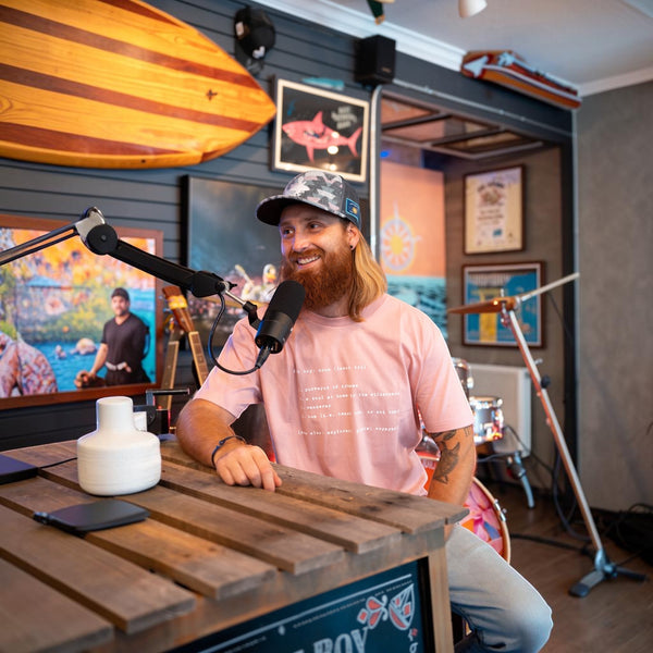Man wearing Men's Lost Boy Definition Tee and fuzzy hat during interview | Lost Boy Creations Key West
