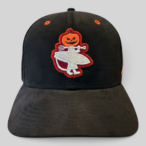 Lost Boy Creations Halloween Hat 2026 in Black — front view, embroidered jack-o'-lantern Lost Boy logo with pitchfork and orange eyelets | Lost Boy Creations Key West