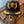 A Pirate's Life for Me Hat in Black — styled on iridescent skull display, yellow pirate skull & crossbones emblem, gold laurel wreath on front & brim | Lost Boy Creations Key West