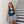Lost Boy Creations Women's Ribbed Octopus Tank in Aegean worn by a woman leaning against a staircase wall showing white Live Like a Lost Boy octopus graphic | Lost Boy Creations Key West