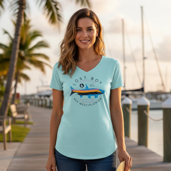Women's Silver King V-Neck arctic blue lifestyle shot worn by woman at marina with Silver King tarpon graphic | Lost Boy Creations Key West