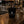 Lost Boy Creations LBC Shot Glass in black ceramic sitting on a wooden bar top showing Lost Boy Creations Key West Florida logo | Lost Boy Creations Key West
