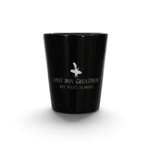 Lost Boy Creations LBC Shot Glass in black ceramic featuring white Lost Boy surfer icon and Lost Boy Creations Key West Florida wordmark | Lost Boy Creations Key West