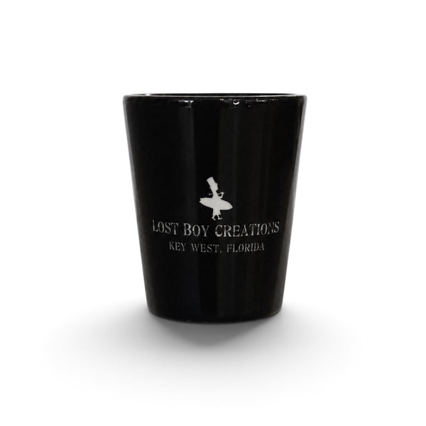 Lost Boy Creations LBC Shot Glass in black ceramic featuring white Lost Boy surfer icon and Lost Boy Creations Key West Florida wordmark | Lost Boy Creations Key West