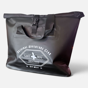 On Deck Dry Bag in Black — front view, white Lost Boy Creations logo print, roll-top closure | Lost Boy Creations Key West
