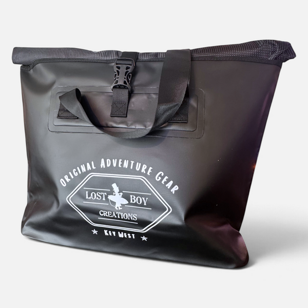On Deck Dry Bag in Black — front view, white Lost Boy Creations logo print, roll-top closure | Lost Boy Creations Key West