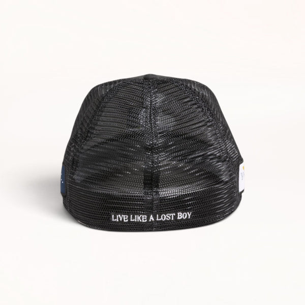 Back view of a Lost Boy Creations all-black mesh trucker hat featuring the text Live Like A Lost Boy embroidered.
