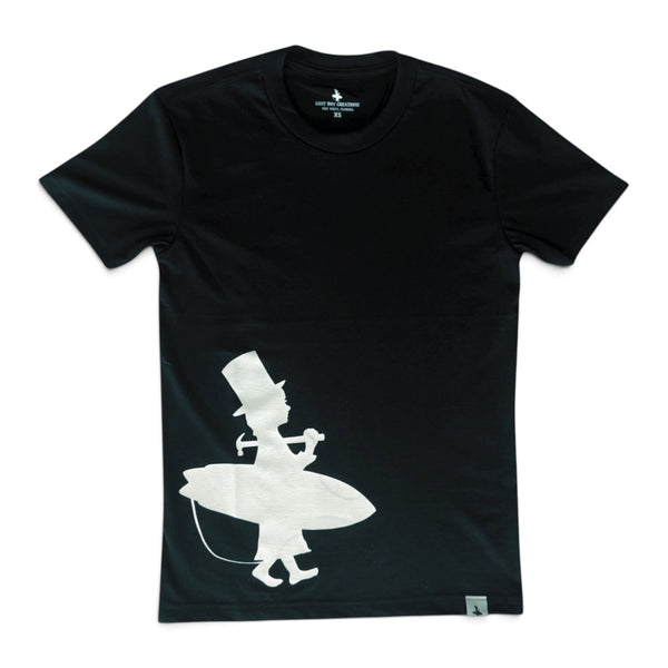 Men's Lost Boy Silhouette Tee black front flat lay with off-center white Lost Boy surfer silhouette graphic | Lost Boy Creations Key West