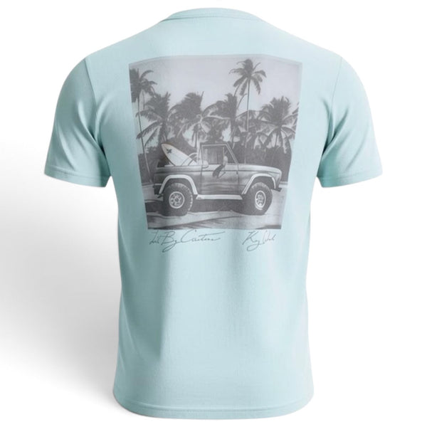 Men's Bronco Tee 2.0 light blue ghost mannequin back view with vintage Bronco and surfboard graphic among palm trees and LBC signature | Lost Boy Creations Key West
