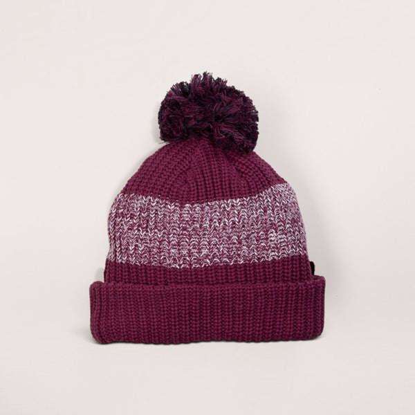 Lost Boy Creations burgundy chunky knit pom pom beanie with a fold-over cuff and gradient texture