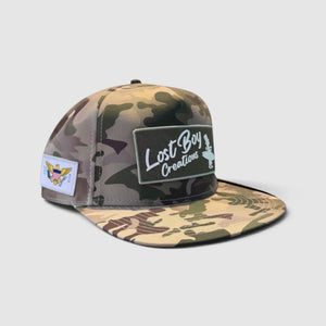 Big Wave Hunter Hat in Camouflage — front view, vintage LBC logo patch with USVI flag side patch | Lost Boy Creations Key West