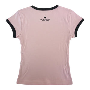 Back view of Lost Boy Creations desert pink ringer tee with black contrast neck and sleeve bands and logo detail.