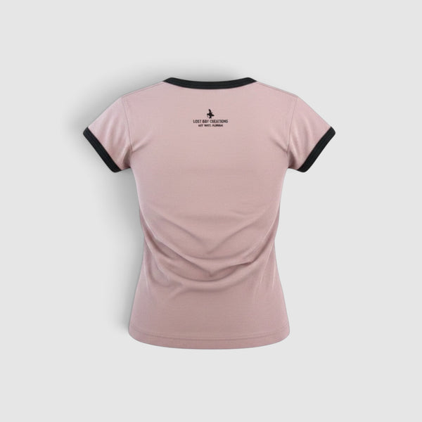 Women's Surfing Club Ringer Tee Desert Pink ringer tee back view with contrast black bands and Lost Boy Creations Key West logo at nape | Lost Boy Creations Key West