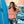 Women's Cropped Beach Day Tee dusty blush lifestyle shot worn by woman leaning against surfboard in front of ocean mural | Lost Boy Creations Key West