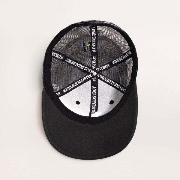 Lost Boy Creations Flex'd black baseball cap interior view showing branded inner taping and mesh back panel