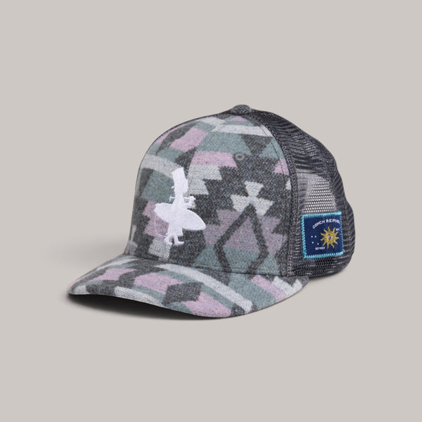 Lost Boy Creations Fuzzy Wuzzy high-crown hat with geometric pattern, mesh back, and side patches on grey background
