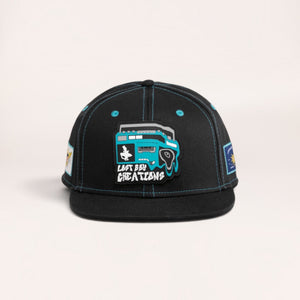 Lost Boy Creations Ghetto Blaster black snapback hat with a blue boombox rubber patch on the front panel