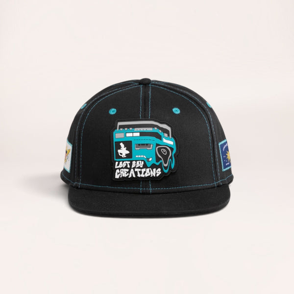 Lost Boy Creations Ghetto Blaster black snapback hat with a blue boombox rubber patch on the front panel