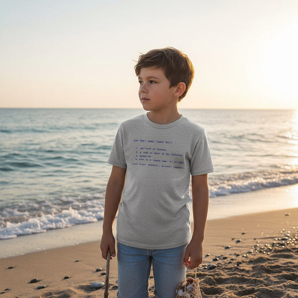 Kid's Definition Tee in Heather Grey — lifestyle, boy wearing tee with Lost Boy definition graphic on the beach | Lost Boy Creations Key West